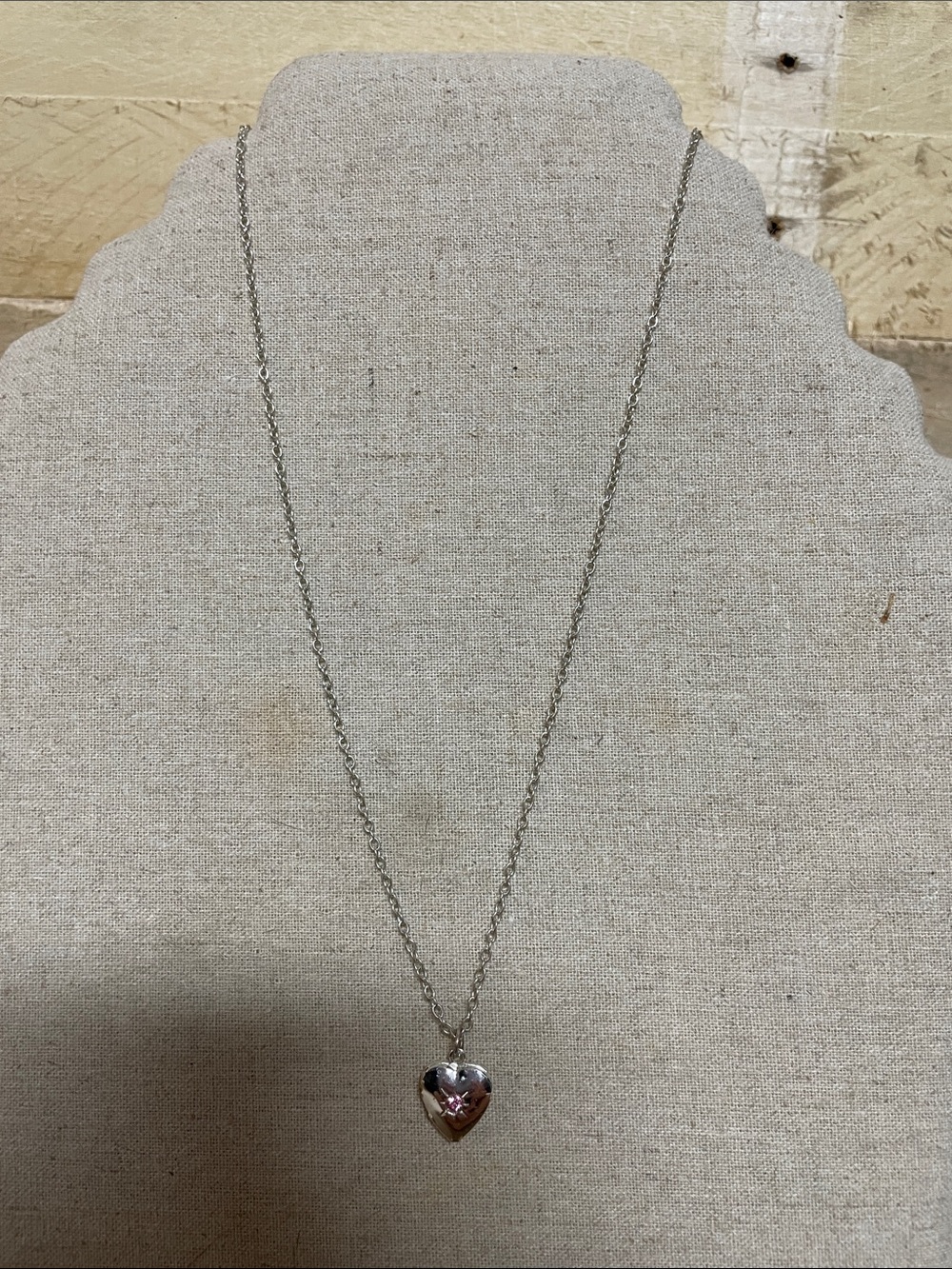 16”-18” chain with 1/2” heart locket with pink sapphire stone